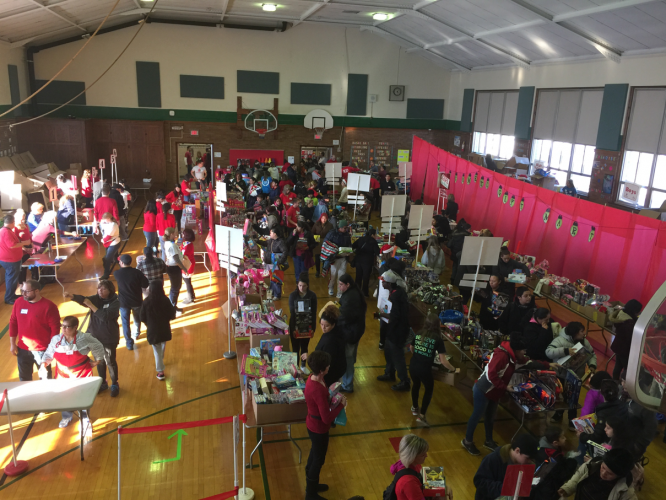 Shoppers fill the gym. 