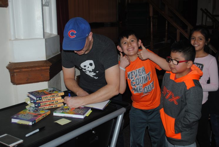 Rodkey autographed several copies of his new book, Stuck in the Stone Age. 