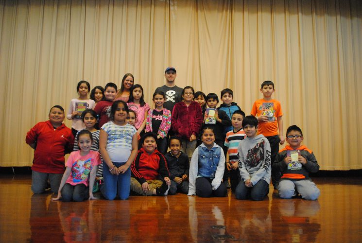 Rodkey poses with Mrs. Linares's 3rd Grade students