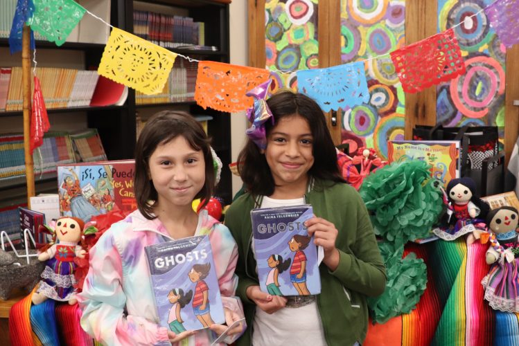 The graphic novel "Ghosts" is a favorite among Bardwell students! (Pictured: Musica Roldan and Kimberly Miranda)