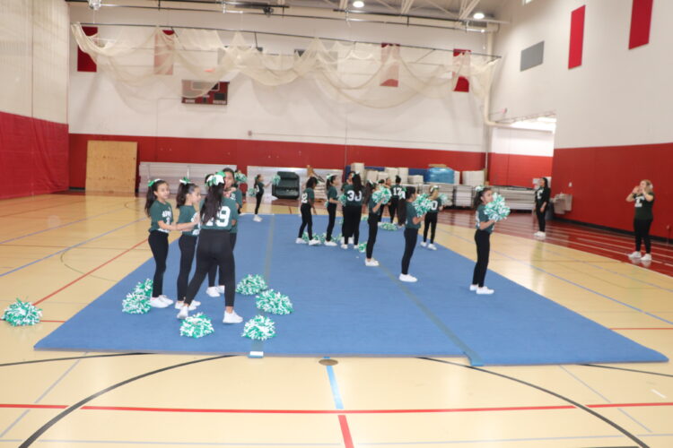 Cheerleaders practice their routine before the tournament.